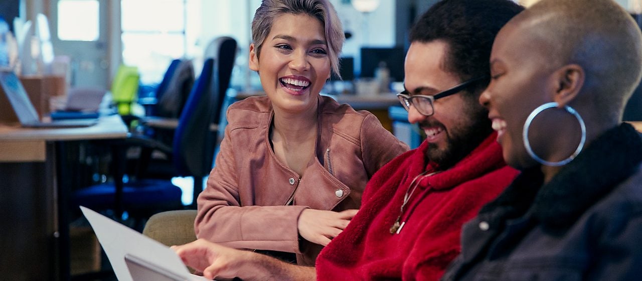 Employees using computers in an office