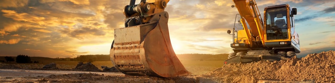 An excavator making trenches on a construction site