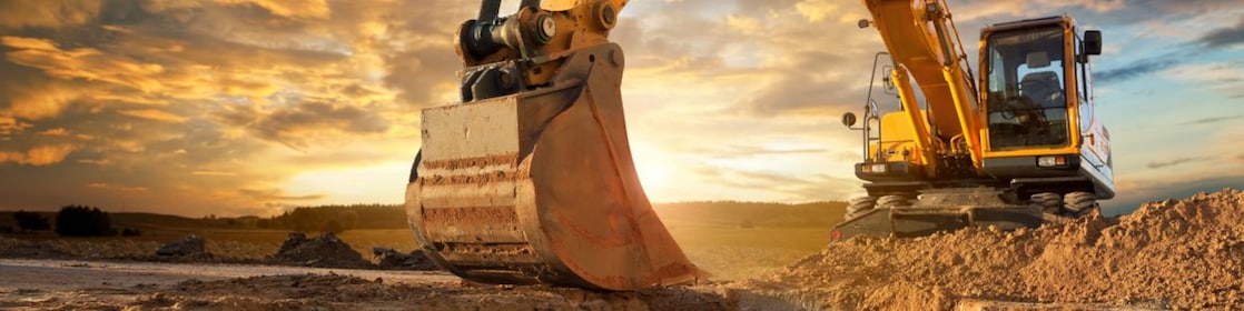 An excavator making trenches on a construction site