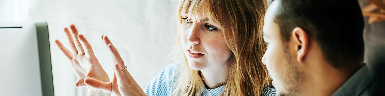 Two business colleagues in conversation