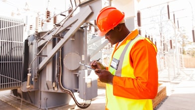 Man carrying out safety checks at a fuel distribution site in South Africa
