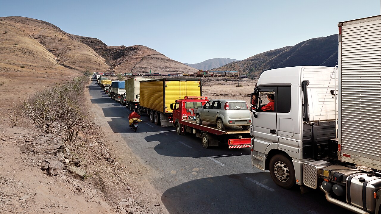 Truck driver driving on empty road