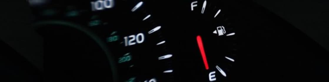 Dashboard display in car showing low fuel