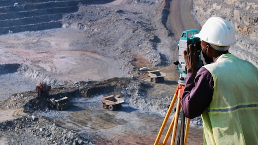 Construction worker taking photo from equipment