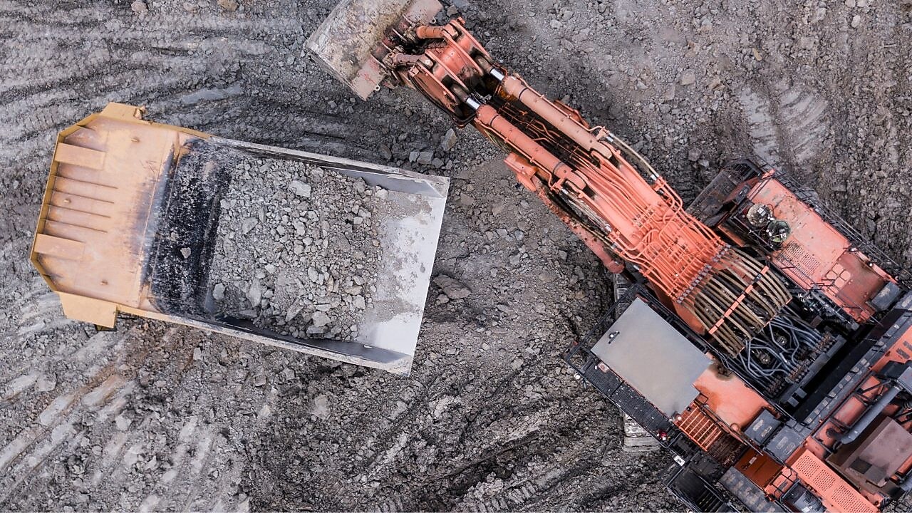 Mining Excavator and Articulated Dump Truck