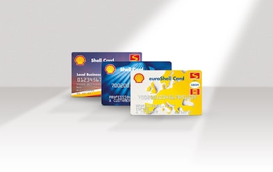 Three different styles shell fuel cards on a grey background, lined up behind one another