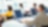  Rear view of four business executives using computers in an office