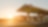 Sun rising behind a Shell station forecourt