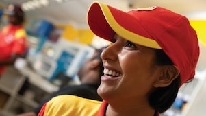 Smiling Shell select employee wearing red cap