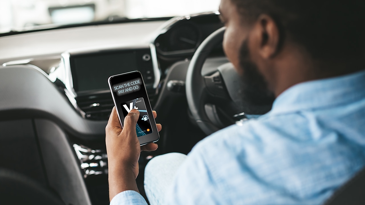 Man with a phone in car