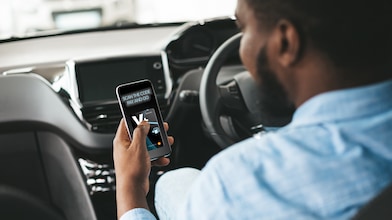 man with a phone in car