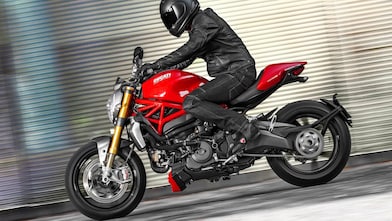 Man riding a bike which is using the Superior Engine Oil For Bikes