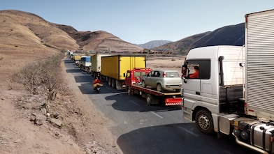 Truck driver driving on empty road