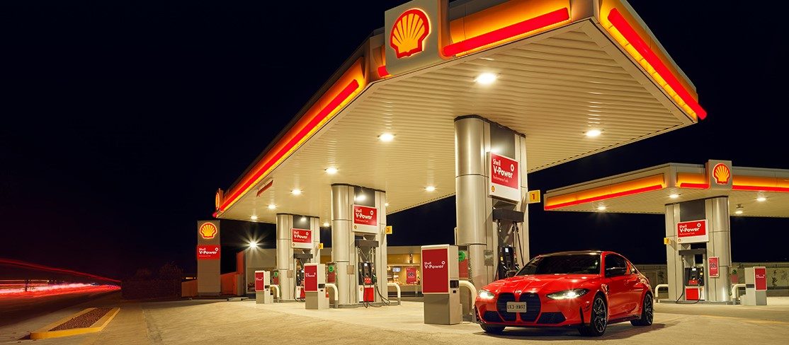 Red color car on shell station
